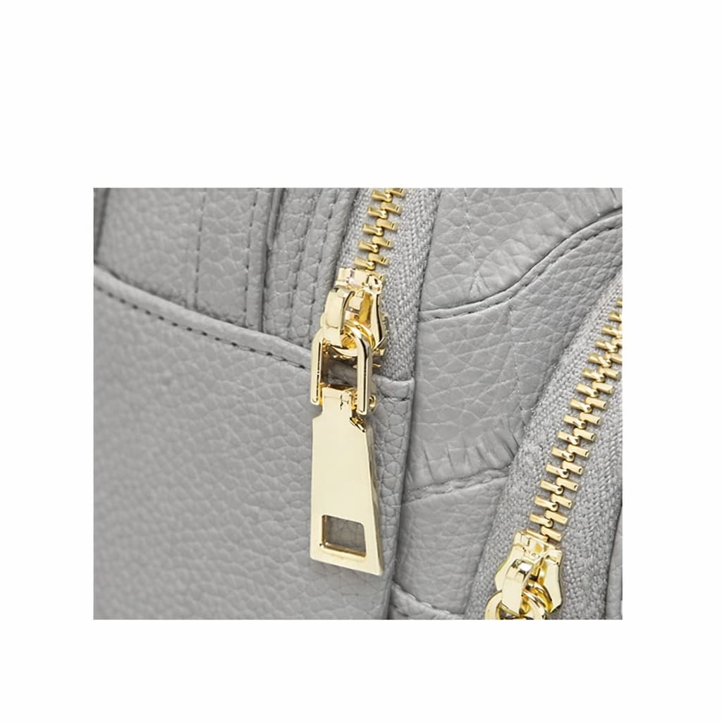 Detalhe do fechamento em zíper elegante da bolsa FOXER Rivelle Gray